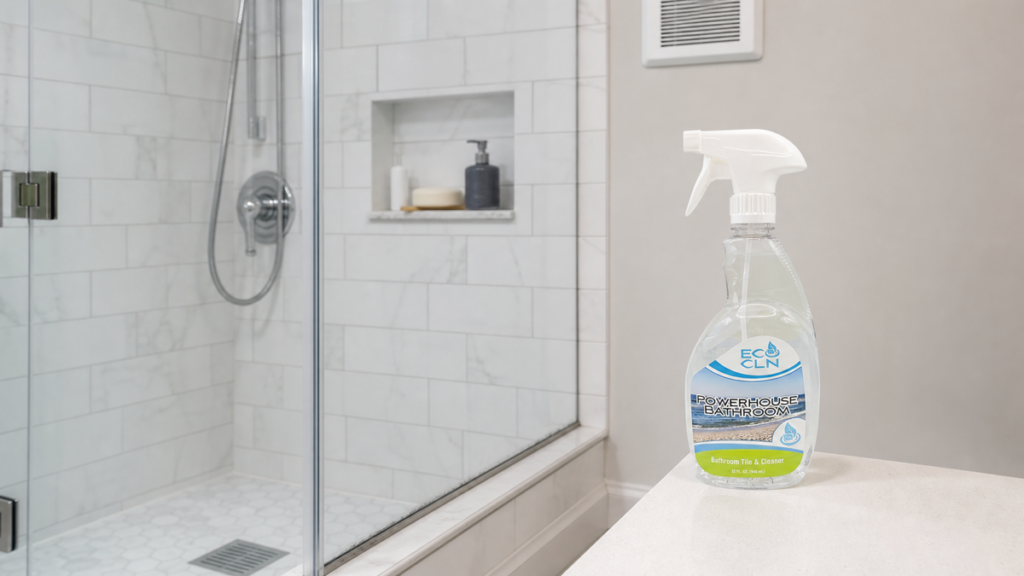 Recurring mildew-looking bathroom residue near a damp shower seam with an exhaust fan and Eco Cln Powerhouse Bathroom nearby.