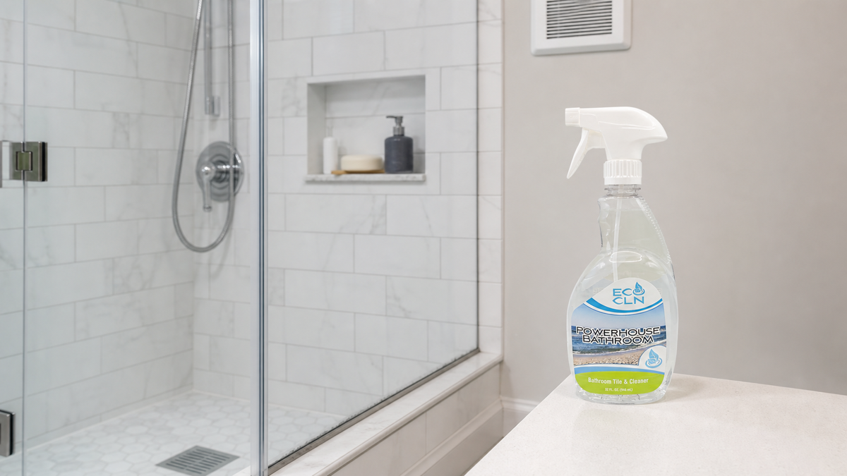 Recurring mildew-looking bathroom residue near a damp shower seam with an exhaust fan and Eco Cln Powerhouse Bathroom nearby.